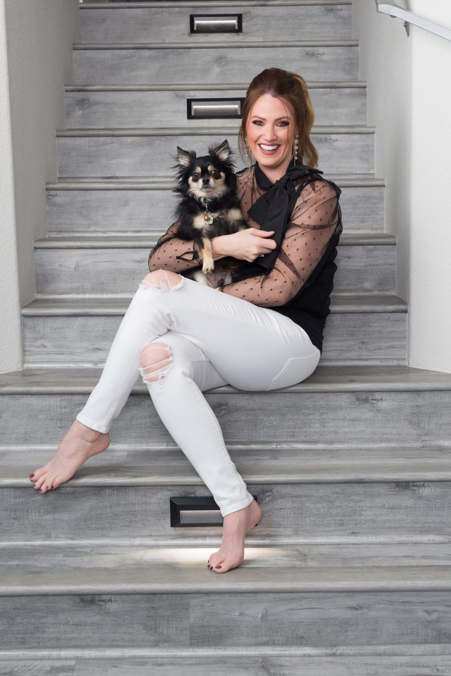 Sharrin Fuller with her Dog Mac, posed on staircase. Personal Branding Photoshoot